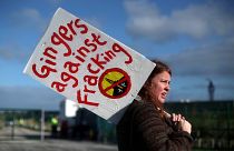 A protester stands outside Cuadrilla's Preston Road fracking site near Blackpool in 2018.