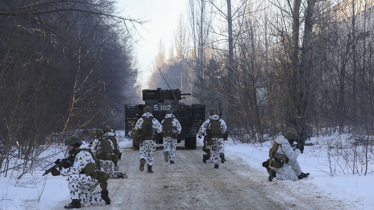 Ukrainian units exercise as they simulate a crisis situation in an urban settlement, in the abandoned city of Pripyat near the Chernobyl Nuclear Power Plant, February 4 2022.