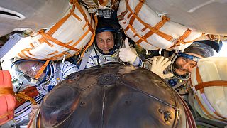 Expedition 66 crew members are seen inside their Soyuz MS-19 spacecraft after is landed