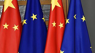 EU and Chinese flags at the Europa building in Brussels