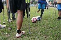A team of amputees in Indonesia's Surabaya train intensively for an upcoming tournament in the capital Jakarta. They formed a football club as a way of fighting despondency.