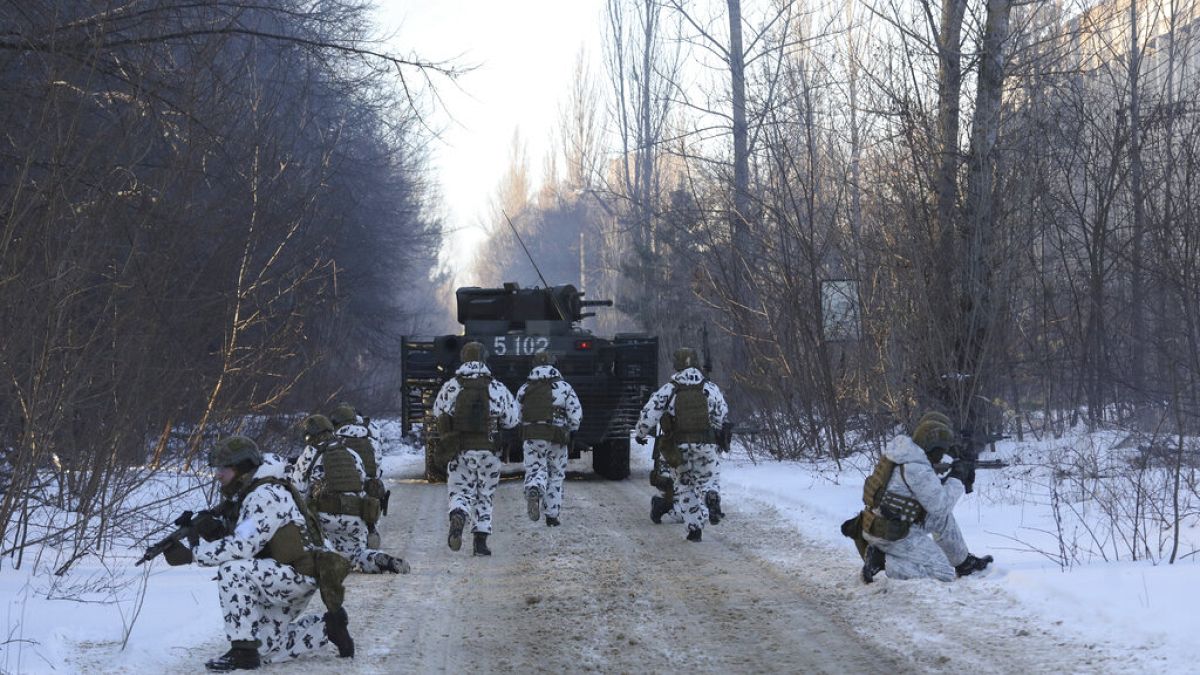 FILE - Ukrainian National Guard, Armed Forces, special operations units exercise as they simulate a crisis situation in an urban settlement, in the abandoned city of Pripyat