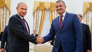 Russian President Vladimir Putin (L) and Anatoly Bibilov, the leader of Georgia's breakaway region of South Ossetia (R) meet in 2018.