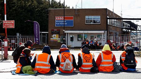 Just Stop Oil activists take part in a protest outside the Esso Birmingham fuel terminal, in Birmingham, Britain April 1, 2022. 