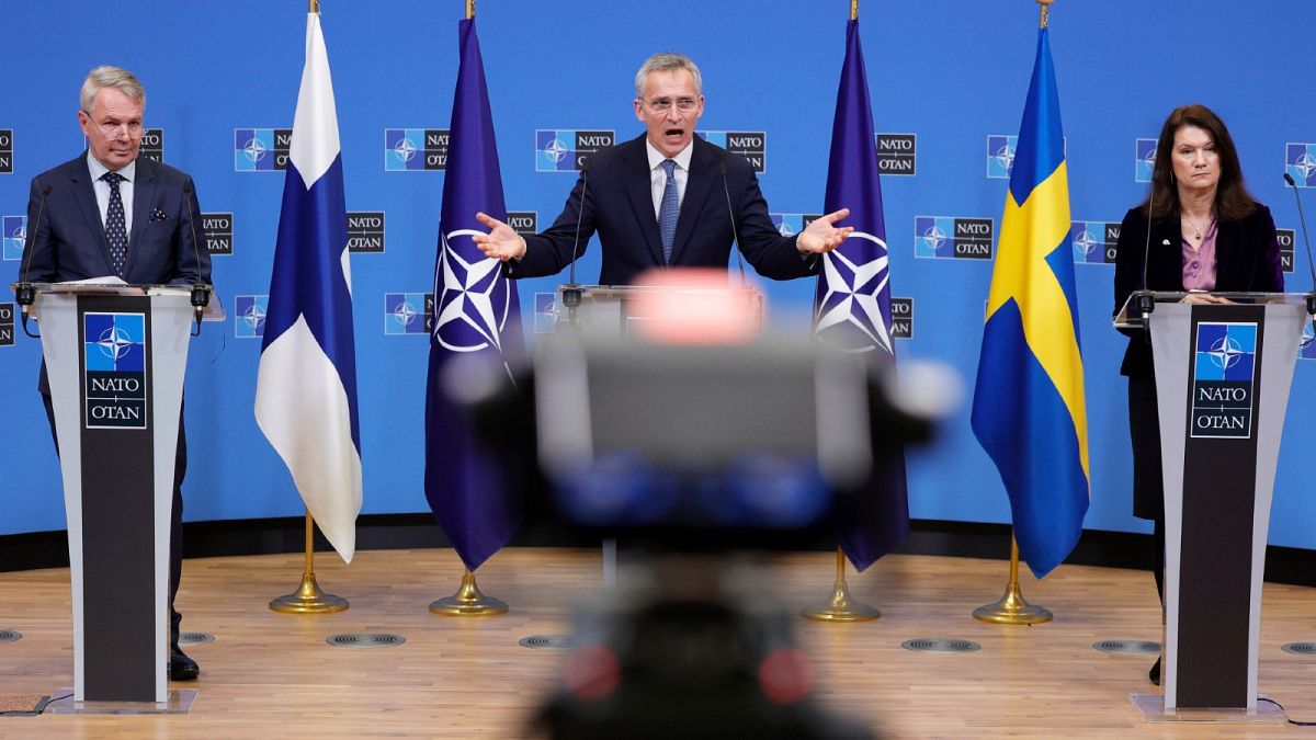NATO's Jens Stoltenberg, centre, participates in a press conference with Finland's Foreign Minister Pekka Haavisto, left, and Sweden's Foreign Minister Ann Linde