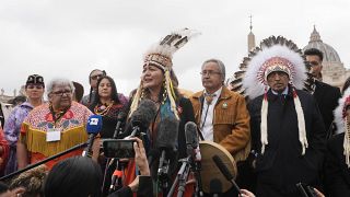 A member of the Assembly of First Nations speaks outside St. Peter's Square at the end of a meeting with Pope Francis at the Vatican