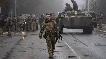 Ukrainian army soldier take part in a military sweep for Russian troops after their withdrawal from villages in the outskirts of Kyiv