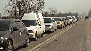 Local residents lineup in their cars to leave Mariupol, March 24, 2022.