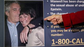 Audrey Strauss, acting US attorney for the Southern District of New York, points to a photo of Jeffrey Epstein and Ghislaine Maxwell.
