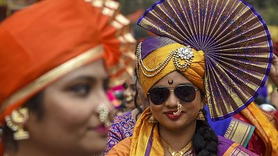 Women dressed in traditional attire take part in a procession celebrating 'Gudhi Padwa' or the Maharashtrian New Year, in Mumbai on April 2, 2022.