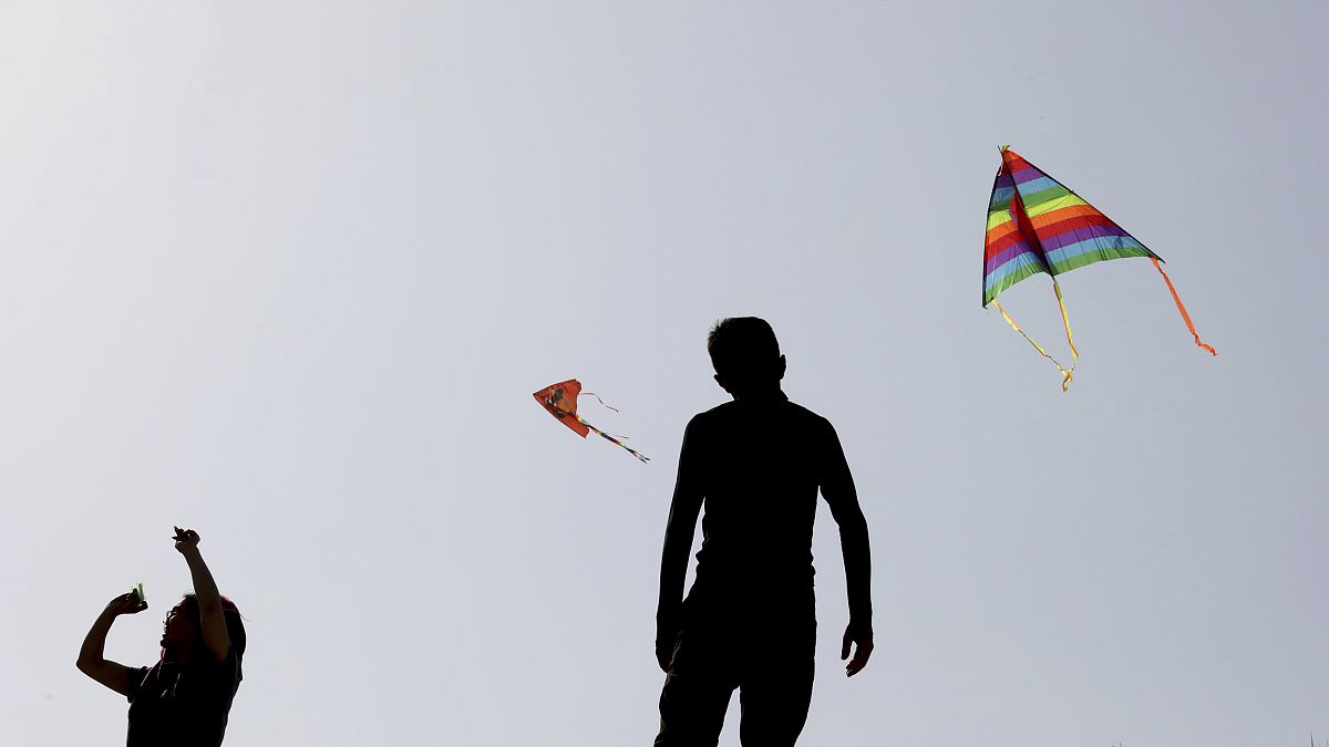 People fly kites during the ancient festival of Sizdeh Bedar, an annual public picnic day on the 13th and last day of the Iranian New Year.