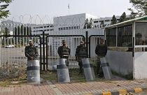 Pakistani paramilitary troops stand guard with riot gears outside the National Assembly, in Islamabad, Pakistan, Sunday, April 3, 2022.