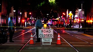 A roadblock is set a block away from the scene of an apparent mass shooting in Sacramento, Calif., Sunday, April 3, 2022.