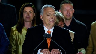 Hungary's Prime Minister acknowledges cheering supporters during an election night rally in Budapest, Hungary, Sunday, April 3, 2022