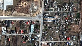 This handout satellite image released by Maxar Technologies on April 4, 2022 shows a view of Yablonska Street in Bucha, Ukraine, on March 31, 2022.