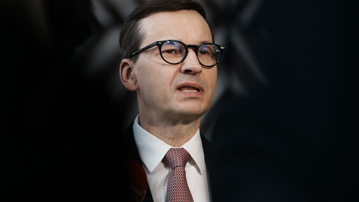 Poland's Prime Minister Mateusz Morawiecki speaks with the media as he arrives for an EU summit in March.