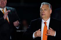 Hungary's Prime Minister Viktor Orban acknowledges cheering supporters during an election night rally in Budapest, Hungary, April 3, 2022.