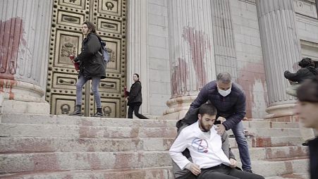 Scientist Rebellion splattered 'blood' across the front of the Spanish Parliament Building