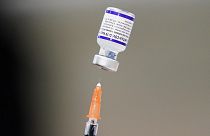 A syringe is prepared with the Pfizer COVID-19 vaccine at a vaccination clinic at the Keystone First Wellness Center in Chester, Pa., on December 15, 2021.