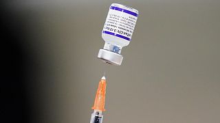 A syringe is prepared with the Pfizer COVID-19 vaccine at a vaccination clinic at the Keystone First Wellness Center in Chester, Pa., on December 15, 2021. 