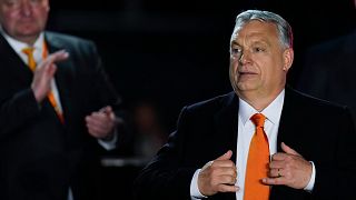 Hungary's Prime Minister Viktor Orban acknowledges cheering supporters during an election night rally in Budapest, Hungary, Sunday, April 3, 2022.