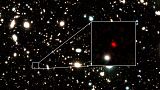 The distant early galaxy HD1, object in red, is shown at the center of this undated zoom-in handout image.