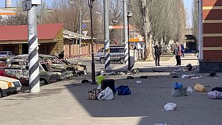 personal belongings of victims and burnt-out vehicles after a rocket attack on the railway station in the eastern city of Kramatorsk, in the Donbass region on April 8, 2022. 