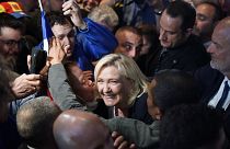 French far-right leader Marine Le Pen smiles to supporters during a campaign rally in Perpignan, southern France, Thursday, April 7, 2022.
