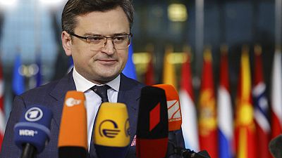 Ukraine's Foreign Minister Dmytro Kuleba speaks with the media as he arrives at NATO headquarters in Brussels