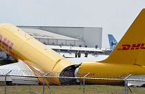 A DHL cargo plane is seen after emergency landing at the Juan Santa Maria international airport.