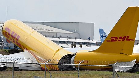 A DHL cargo plane is seen after emergency landing at the Juan Santa Maria international airport.