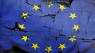 The EU flag showing cracks. 