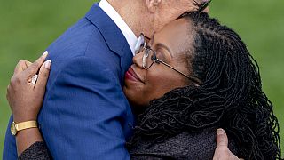 Ketanji Brown Jackson hugging US President Joe Biden