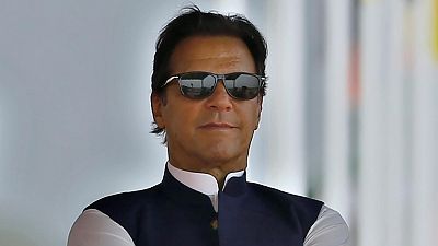FILE - Pakistan's Prime Minister Imran Khan attends a military parade to mark Pakistan National Day, in Islamabad, Pakistan on March 23, 2022.