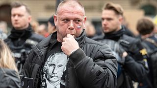 A man wears a T-shirt depicting Russian President Putin at the pro-Russian demonstration in Frankfurt, Germany, Sunday, April 10, 2022