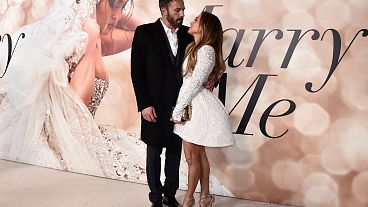 FILE - Cast member Jennifer Lopez, right, and Ben Affleck attend a photo call for a special screening of "Marry Me" at DGA Theater on Tuesday, Feb. 8, 2022, in Los Angeles.
