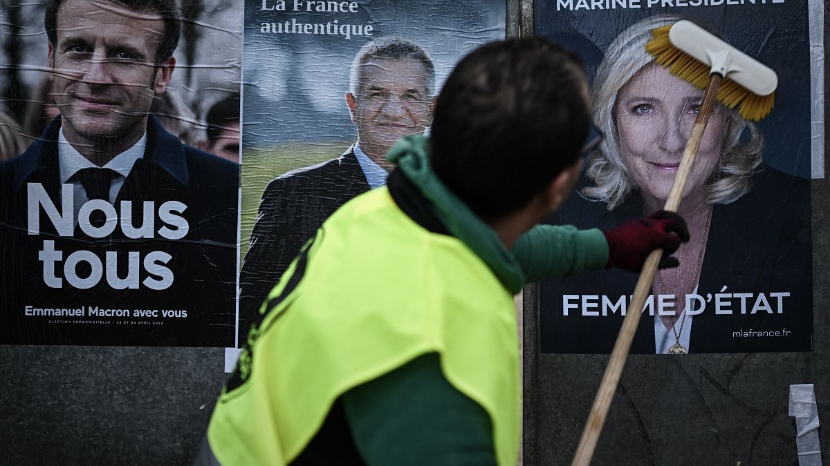 Campaign posters of Emmanuel Macron (left) and Marine Le Pen (right)