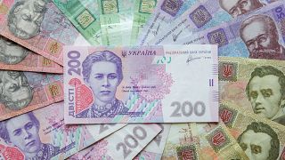 Ukrainian hryvnia banknotes are seen in a photo illustration shot in Kyiv, Ukraine