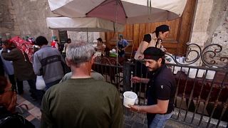 Syrians queue to receive free Iftar meals in Damascus