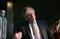 Boris Johnson samples an Isle of Harris gin as he visits a UK Food and Drinks market, set up in Downing Street, London, Tuesday Nov. 30, 2021