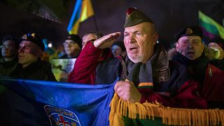People take part in a protest against Russian invasion of Ukraine, in Vilnius, 24 February 2022
