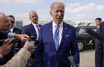 President Joe Biden speaks to reporters before boarding Air Force One at Des Moines International Airport in Iowa on 12 April, 2022