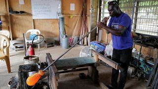 Ghana's only glassblower Michael Tetteh produces glassware at his workshop, in Krobo Odumase.