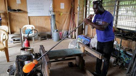 Ghana's only glassblower Michael Tetteh produces glassware at his workshop, in Krobo Odumase.