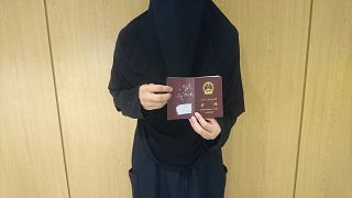 جواز سفر صيني لسيدة أويغورية في السعودية مهددة بالترحيل إلى الصين.