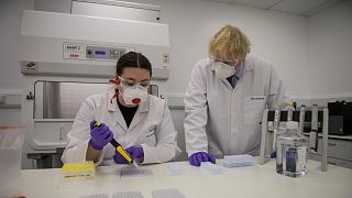 File - UK Prime Minister Boris Johnson visits the lab of French biotech Valneva in Livingston, Scotland, on January 28, 2021.