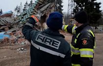 Rescuers clear rubble from damaged houses in Chernihiv