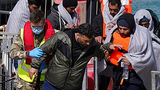 A group of people thought to be migrants are brought in to Dover, Kent, following a small boat incident in the Channel, Thursday April 14. 