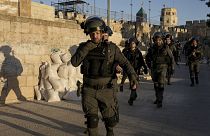 Israeli security forces gather during clashes with Palestinian demonstrators at the Al Aqsa Mosque compound in Jerusalem's Old City