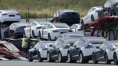 In this photo from May 2020, Tesla cars are loaded onto carriers at the Tesla electric car plant in California. Tesla just announced a new recall of 595,000 vehicles.